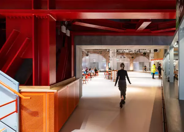 Interior of Aviva Studios with a visitor walking through