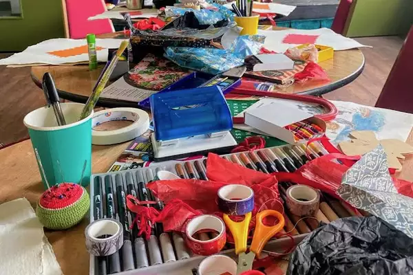 A messy table of crafts