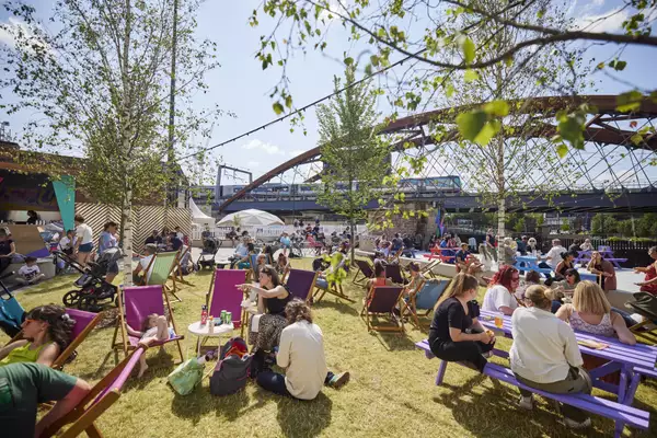 Photo of people chatting on deck chairs