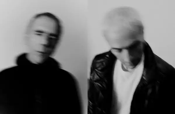 A black and white photograph of Karl Hyde and Rick Smith of electronic music group Underworld