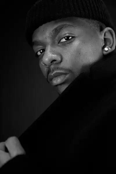 Free Your Mind dancer Tanaka Bingwa wearing a black beanie and coat