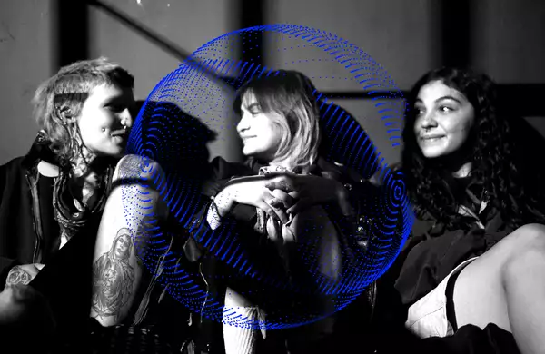 A black and white photograph of three friends